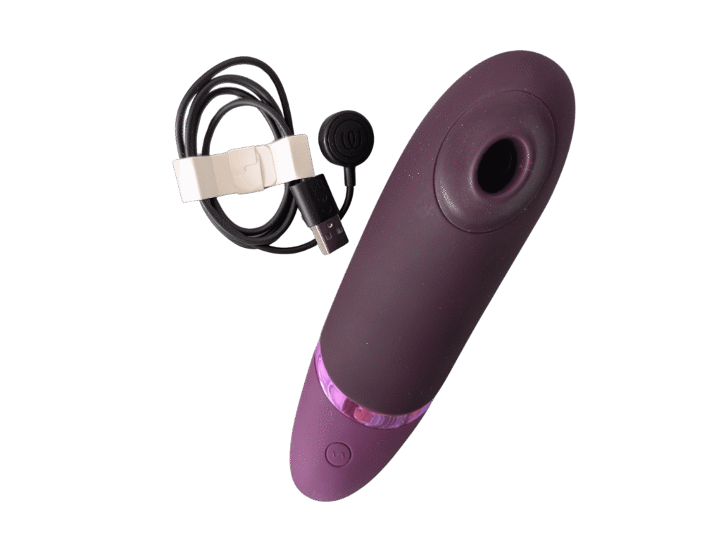The Womanizer Next with branded charging cable